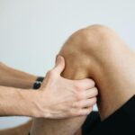 Sports medicine, provider holding a knee