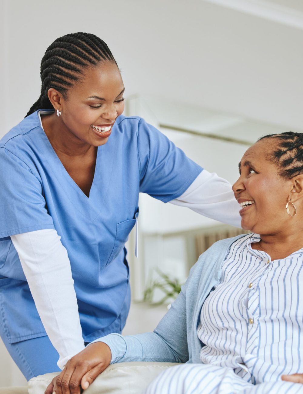 Nurse woman, senior patient and talking for support, healthcare and happiness at retirement home. Black person and happy caregiver together for trust, elderly care and help for health and wellness.