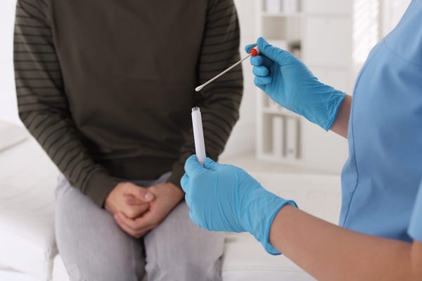 Doctor taking sample for HPV testing